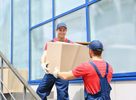 Removal team handling boxes safely during a move