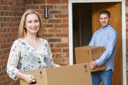 Local team collecting bulky furniture in a busy South London street