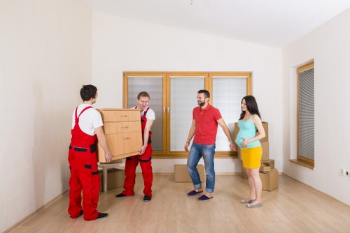 Careful wrapping of fragile household items during a local packing service