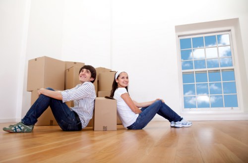 Removal team preparing furniture safely before a move