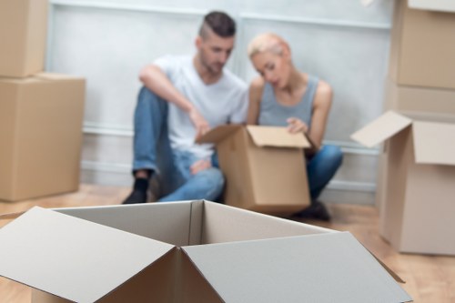Packed moving boxes and furniture ready for local house removals