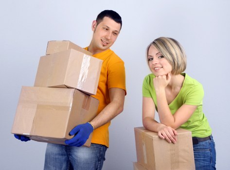Professional movers coordinating a relocation process for homes and offices